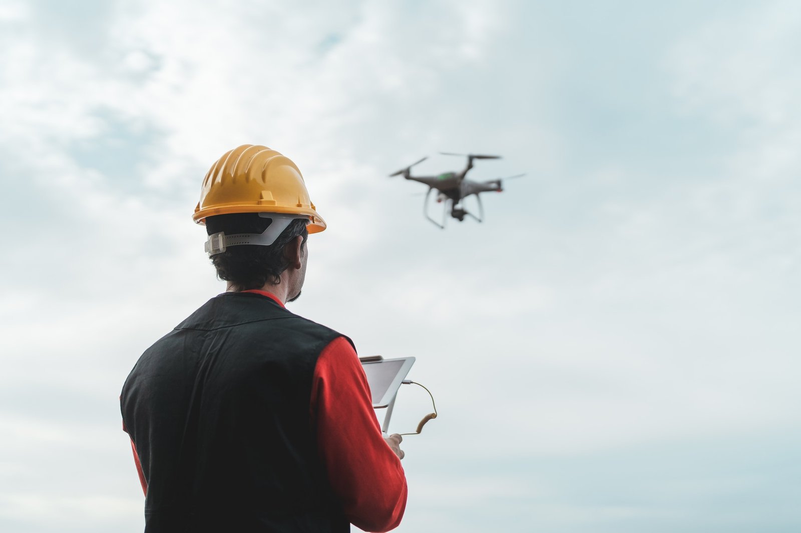 male-engineer-monitoring-construction-site-with-drone-technology-and-industrial-concept.jpg